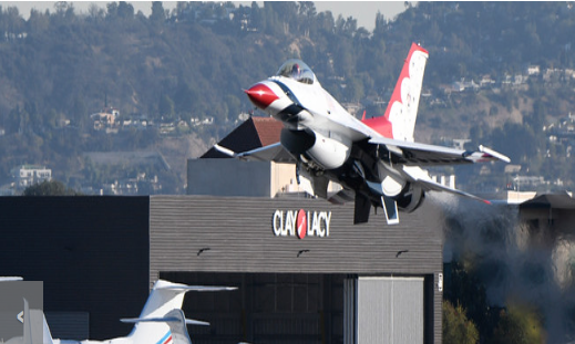 Thunderbirds jets make flybys at theVan Nuys airport during the Memorial for war and test pilot Bob Hoover at Clay Lacy Aviation